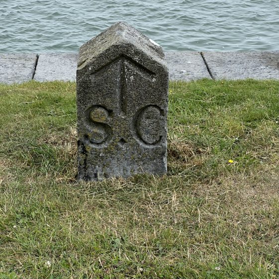 Broad Arrow on granite stone at Querrin Pier. S.C. stands for Shannon Commission who constructed the pier and was considered British Naval Property. | Robert Brown